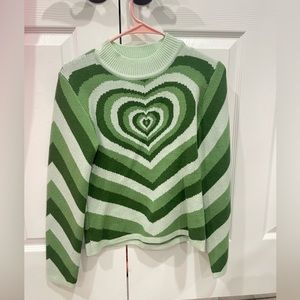 A green heart patterned sweater from Cider, size extra small.